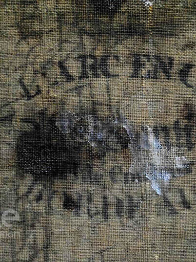 Firma cuadro en el reverso de la tela